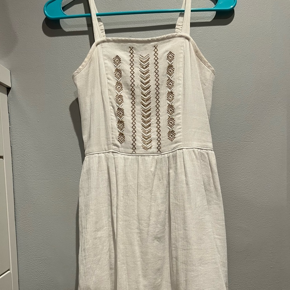 white dress with gold pattern